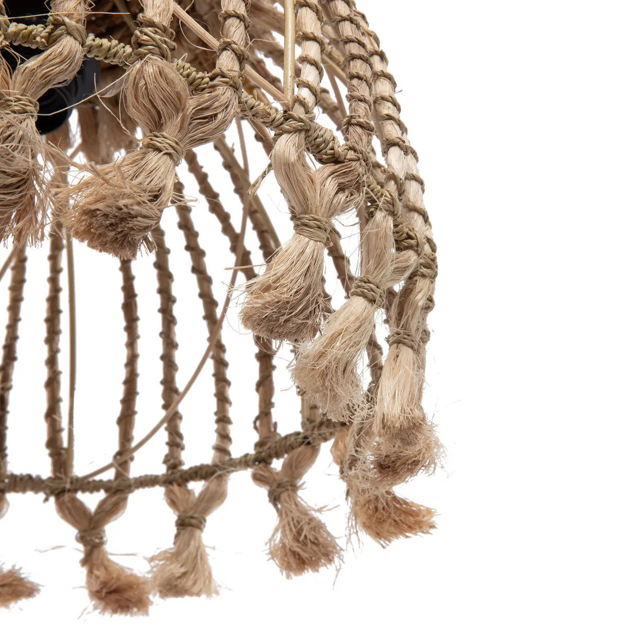 Close-up of a textured woven object with braided ropes on a white background